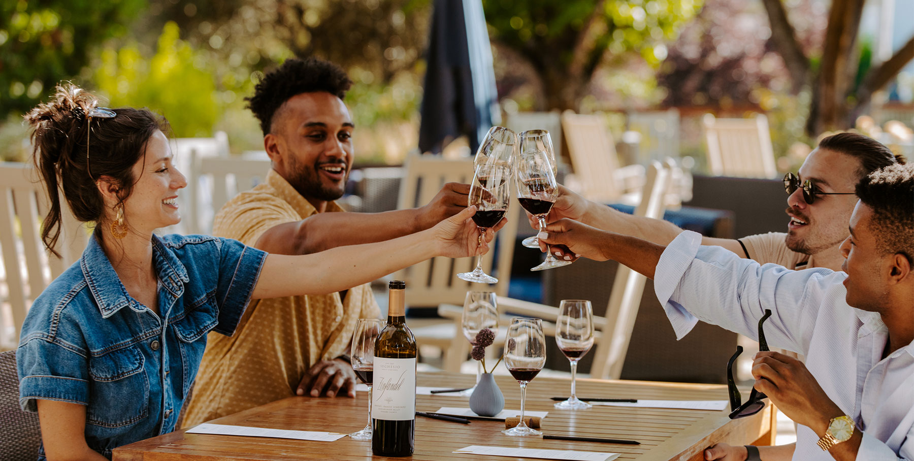 People raising wine glasses together